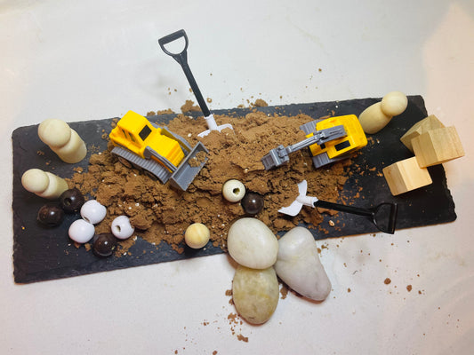 Pour and play dirt for sensory play (Construction theme)